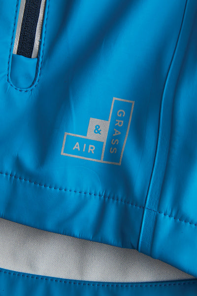 Boys Turquoise Rainster waterproof jacket by British brand Grass & Air - modern, stylish rainwear for kids
