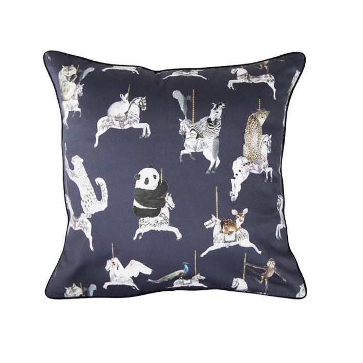 Carousel animal print cushion by independent British brand Wild Hearts Wonder featuring carousel horses on the front and raindrop print on the reverse