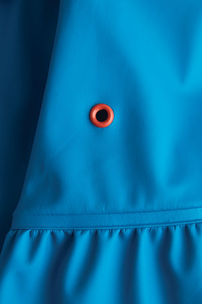 Girls Turquoise Rainster waterproof jacket by British brand Grass & Air - modern, stylish rainwear for kids